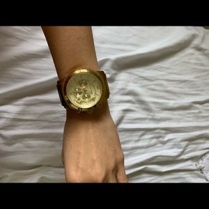 Michele Kors gold watch.